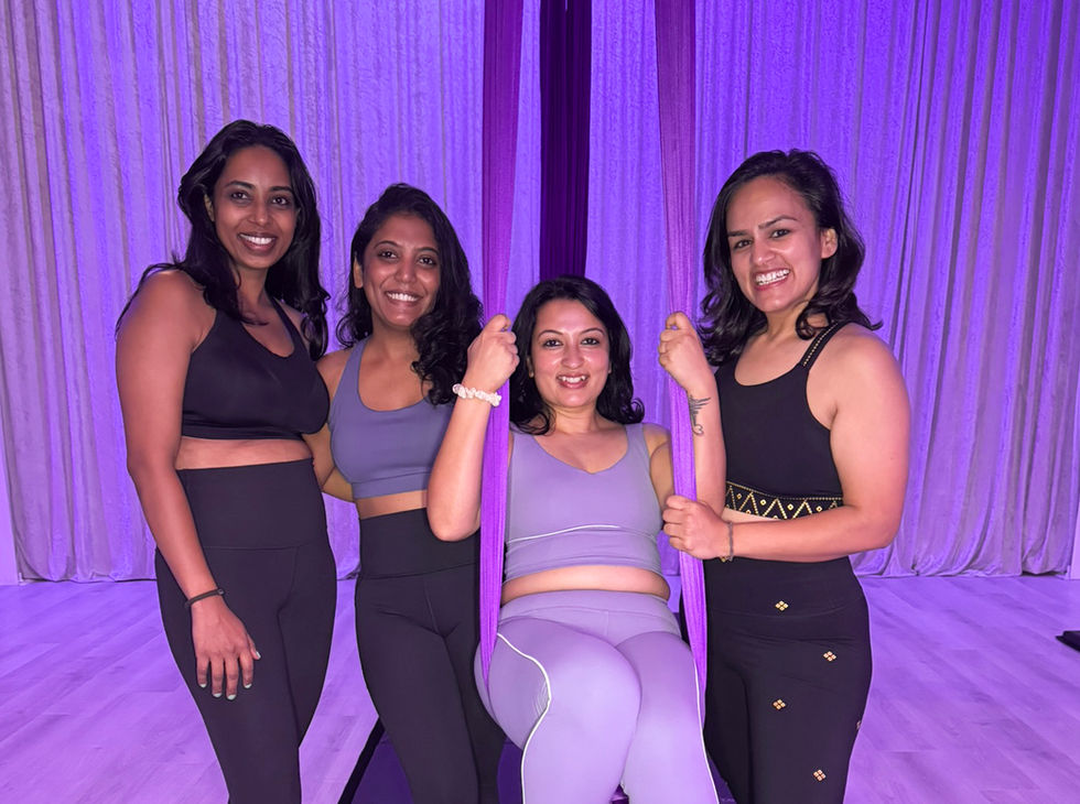 Group of friends taking an aerial silk class