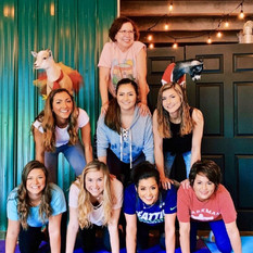 Bachelorette party doing goat yoga