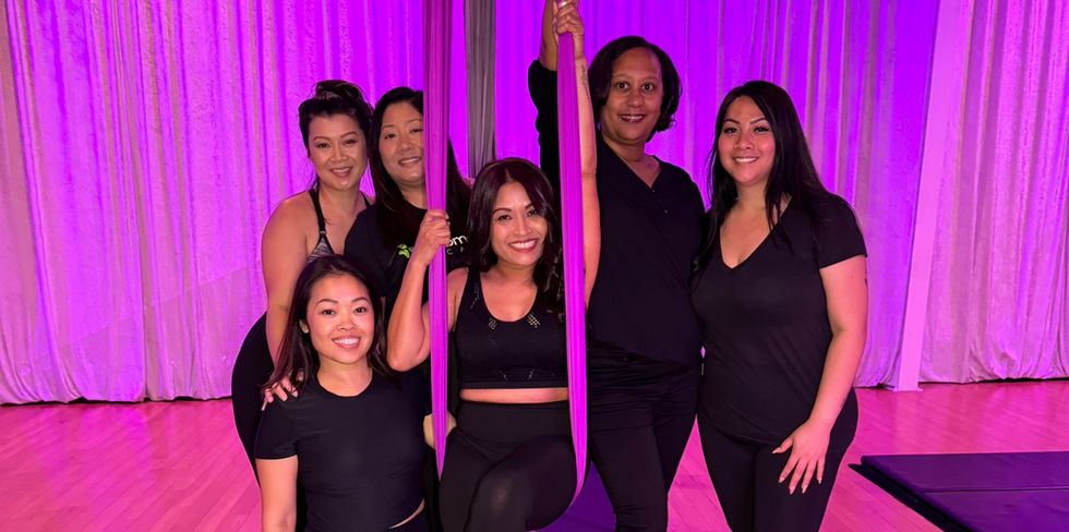 Bachelorette party having fun with an aerial silks lesson