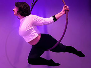 Aerial hoop student posing in the hoop