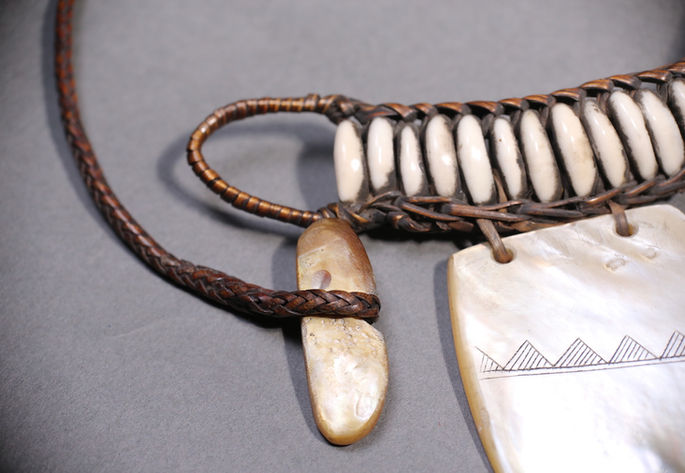 An intricate basket work holds the mother-of-pearl and cowrie shells to form the shape of pangalapang ornament 