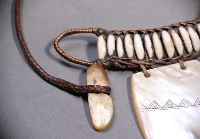 An intricate basket work holds the mother-of-pearl and cowrie shells to form the shape of pangalapang ornament