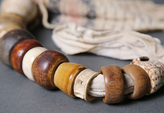A closer look at the akosan’s shells. Earth-tone-colored shells were used to incorporate into the belt