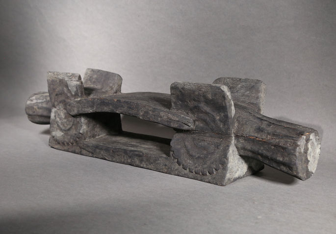 The carved designs on each side of the item is said to be based on the structure of pig’s head