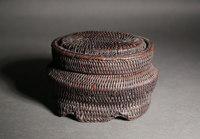 An old dark brown jewellery basket