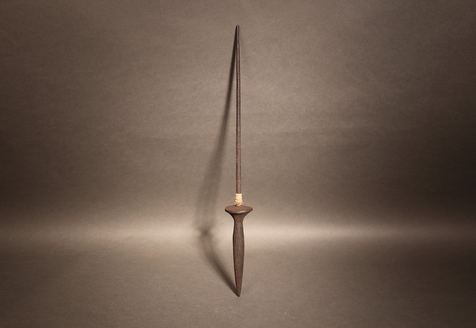An old wooden spindle with thread