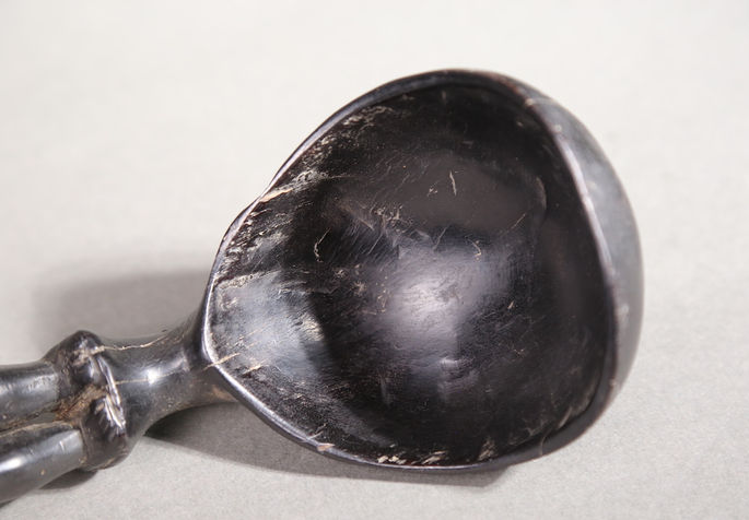 A detailed shot that shows the ladle’s bowl with signs of scratches and wears