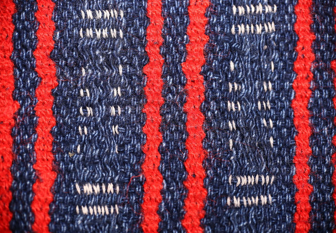 A detailed shot featuring two mortar-like motifs