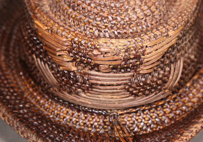 A tightly woven hat with detailed designs