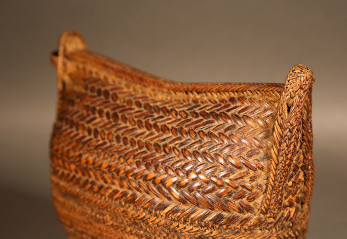 A detailed shot on the plaited construction and the intricate basketwork on its side