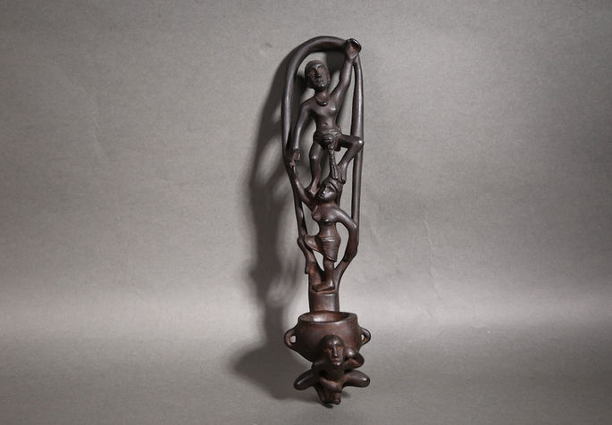 A very intricately carved wooden wine dipper from the Cordillera