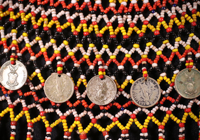 A detailed shot of the karawaweng’s intricate beadwork and the incorporation of 1940s ten centavo coins that were used during the American period in the Philippines