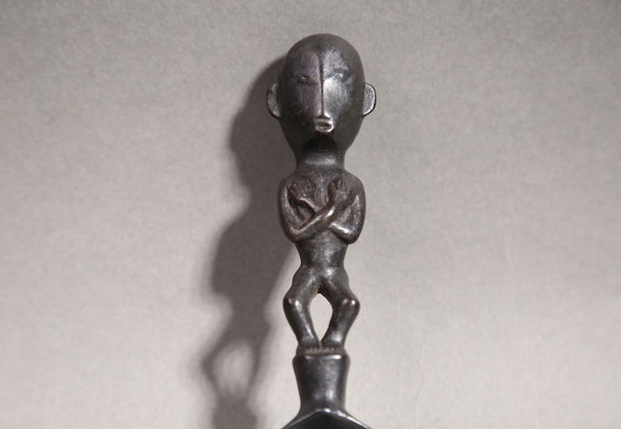 A closer look at the handle with anthropomorphic carving