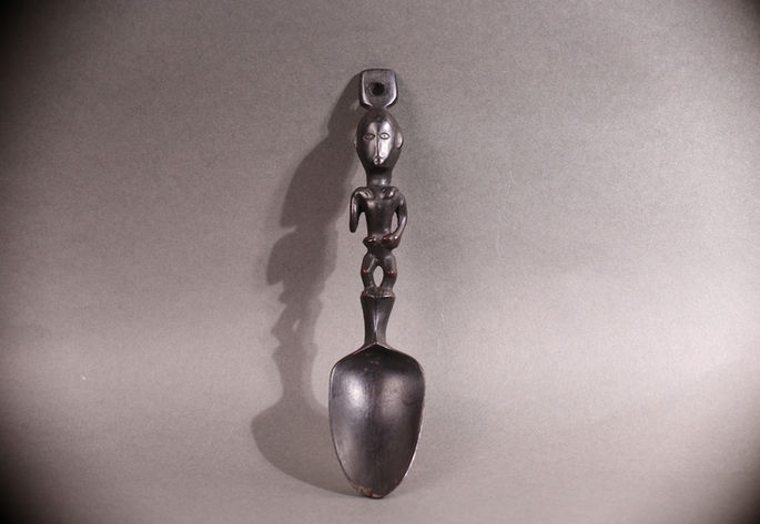 A hero shot of a pakko with mother-and-child carving on the handle
