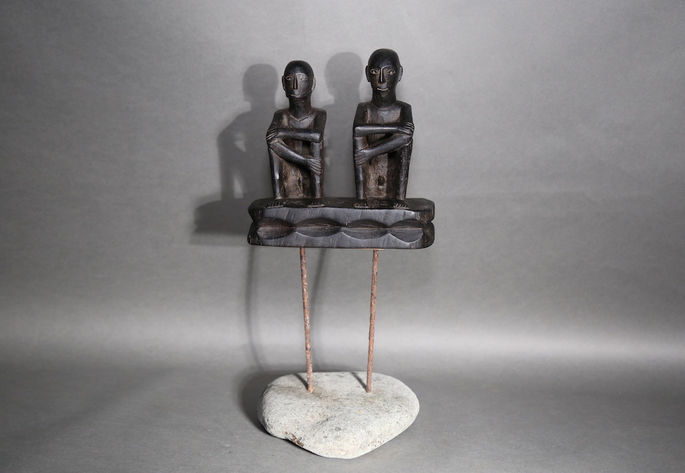 A glossy, light encrustation patina of the anthropomorphic figure
