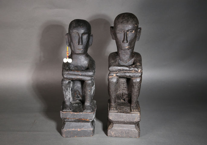 8 & 9.) A pair of seated bululs carved from narra wood exemplifying an archaic style