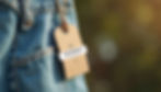 Close-up view of a sustainable clothing tag attached to an eco-friendly garment