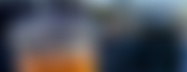 Drinking tea while walking the High Line: Clear cup with the Black Seed Bagel logo and city landscape in the background