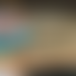 I'm wearing a volcano designed beanie looking at the Hawai'i Volcanoes National Park visitors center sign