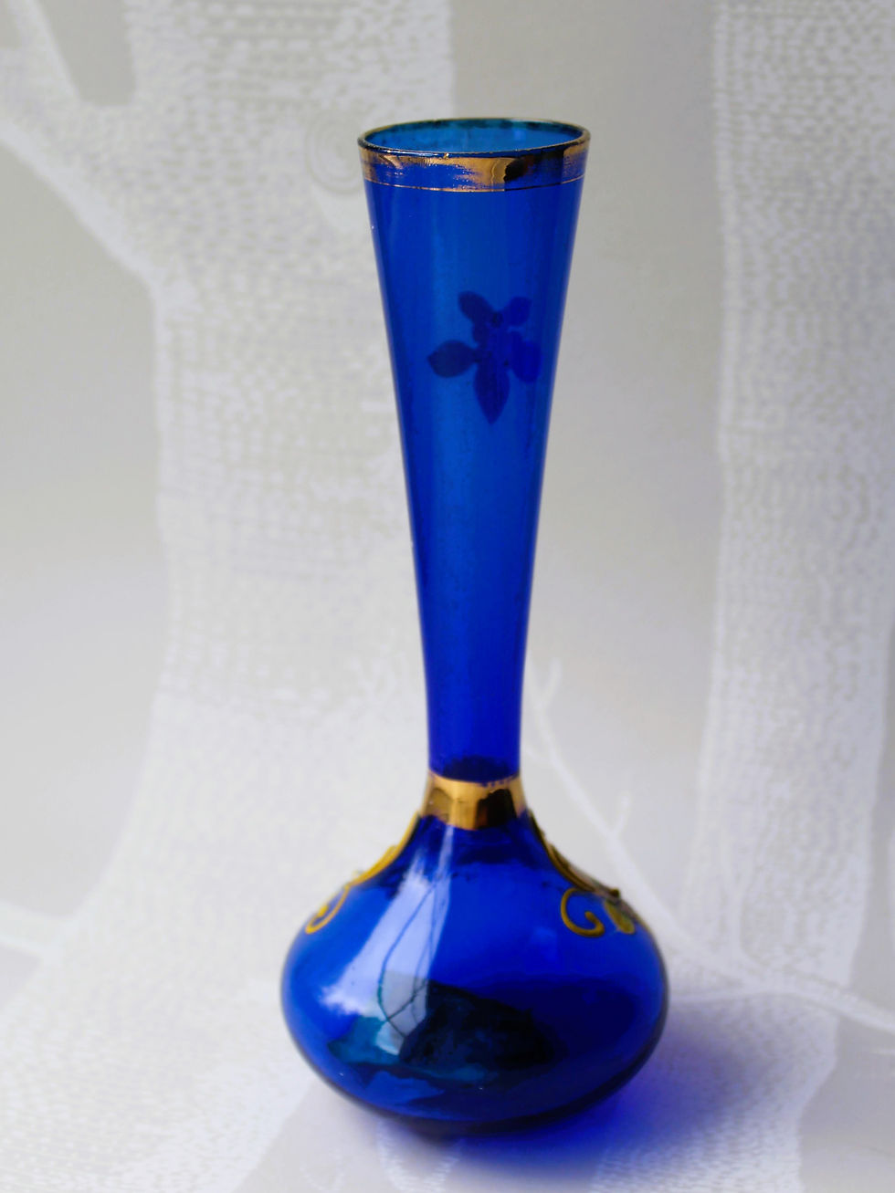 Thumbnail: Mid-century blue glass bud vase with gold accents