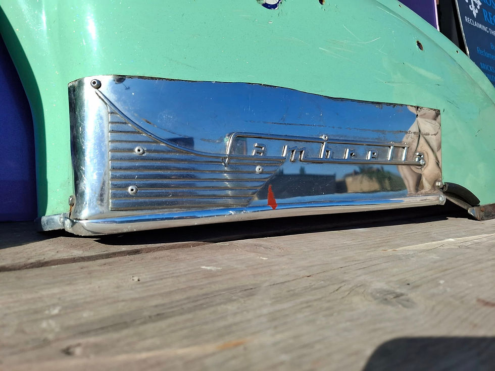 Thumbnail: Close view of mint green Lambretta panel with roundel paint detail and drilled fixing points.