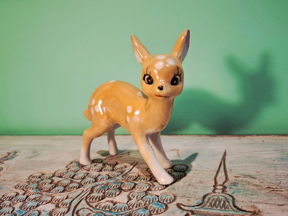 Thumbnail: Cute kitschy ceramic fawn with cartoon features.