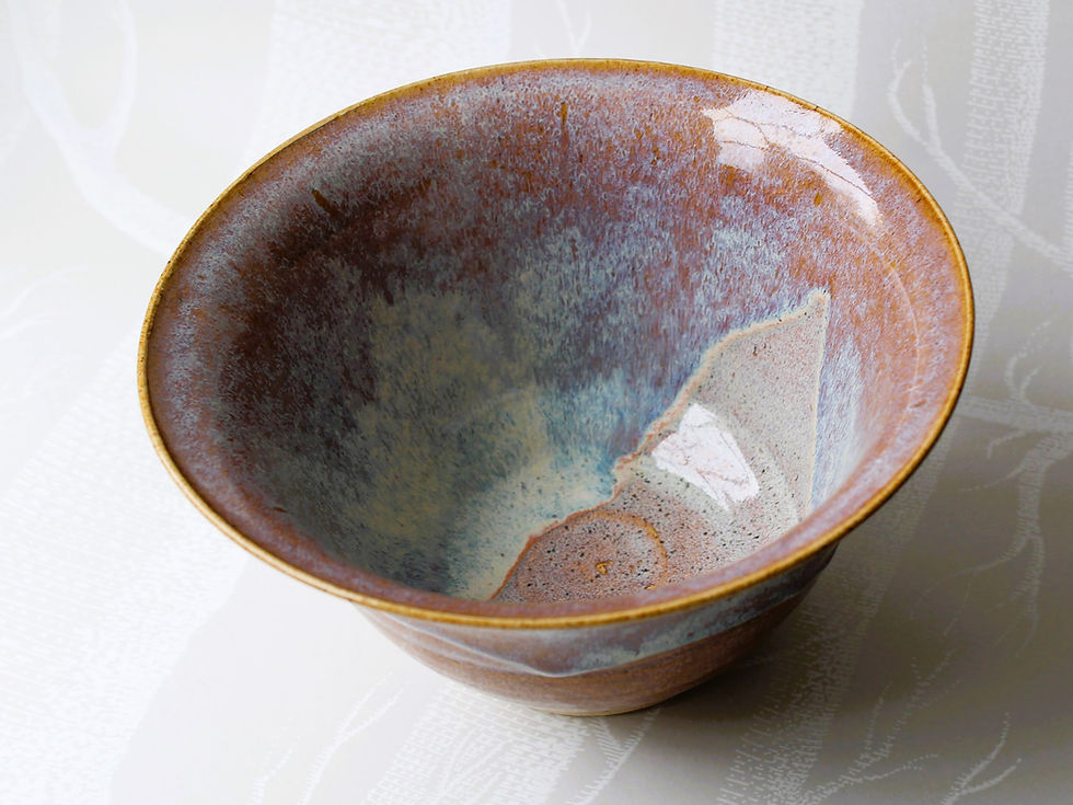 Thumbnail: Top view of handmade pottery bowl showing lilac and blue glaze interior