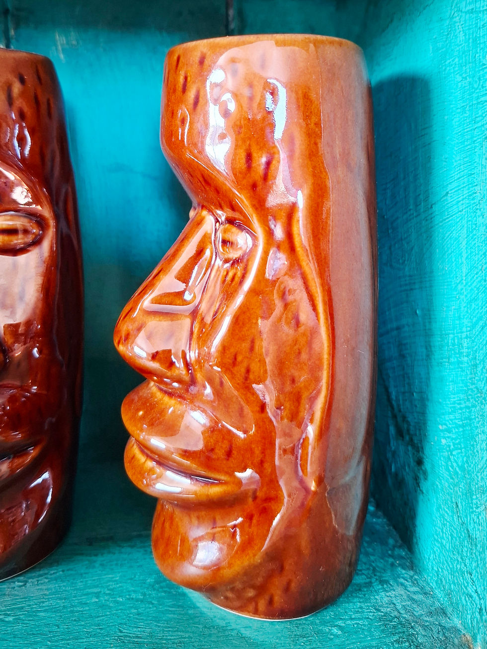 Thumbnail: Side angle of second tiki mug with detailed Moai face