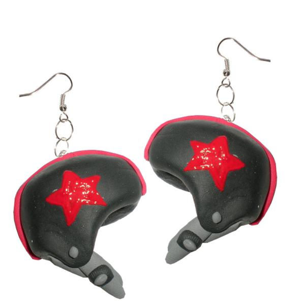 Roller derby helmet earrings by Drown Soda – black helmet design with red star and strap details, hanging from silver hooks