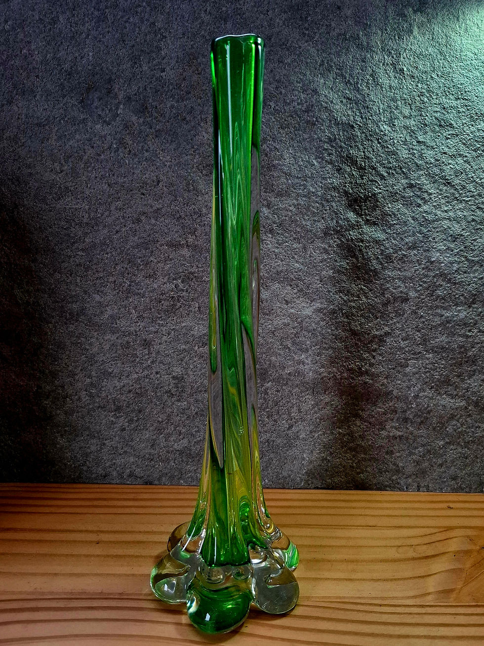 Thumbnail: Tall green hand-blown glass vase showing flowing lines and organic shape.