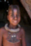 Child with two hair plaits over face