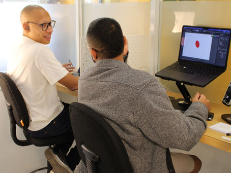 Two friends coworking and discussing