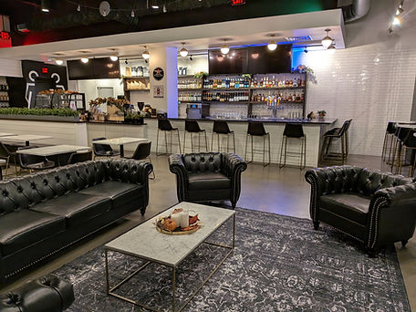 Comfortable armchairs and couches with marble tables