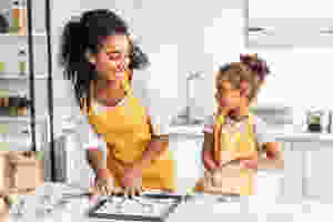 Mother and child baking cookies