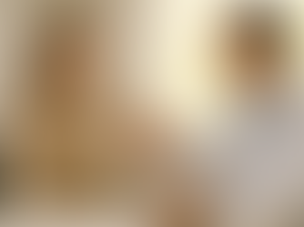 A calm female patient sits on a consultation chair, wearing a beige sweater, while a doctor in a white coat with a stethoscope holds a vitamin D supplement bottle towards her in a bright, sunlit NHS-style consultation room with minimalistic neutral tones.