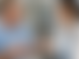 A doctor calmly explaining treatment to a patient with hand tremors in a hospital setting, illustrating a PLAB 2 scenario of lithium toxicity management.