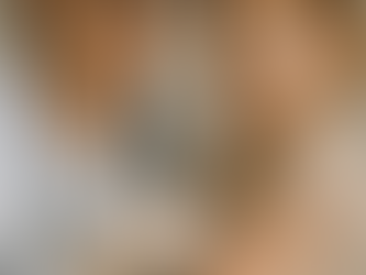 A female pediatric doctor wearing a white coat and gloves gently examines a red rash on a young child's arm, illustrating a typical PLAB 2 clinical scenario. The child, around 3 to 4 years old, looks down quietly. The background is softly lit and neutral, emphasizing a calm clinical setting and focused medical care.