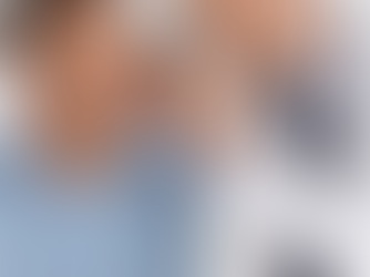 Doctor examining a patient’s ear with an otoscope in a clinic setting, demonstrating ear examination skills for PLAB 2, focusing on diagnosing otitis externa, otitis media, and identifying red flag features.