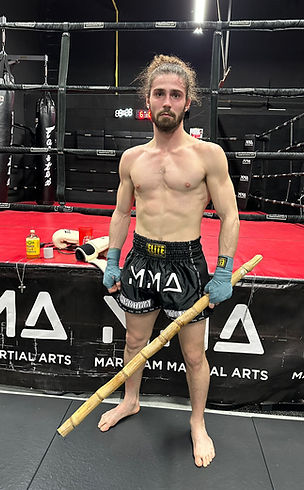 "Nak Muay/Fighter Anthony 'The Bulgar' Georgieff standing in front of the ring at Markham Martial Arts gym: Anthony exudes de