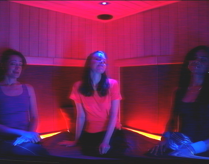 Friends receiving heat therapy in the infrared sauna in Winter Garden