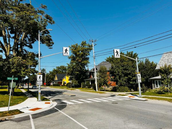 Marked crosswalk with pedestrian signage and beacon near Jacob Beam Public School in Beamsville, Ontario.
