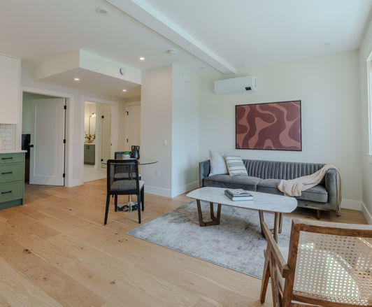 Contemporary townhouse interior layout with recessed ceiling lighting and open flooring.