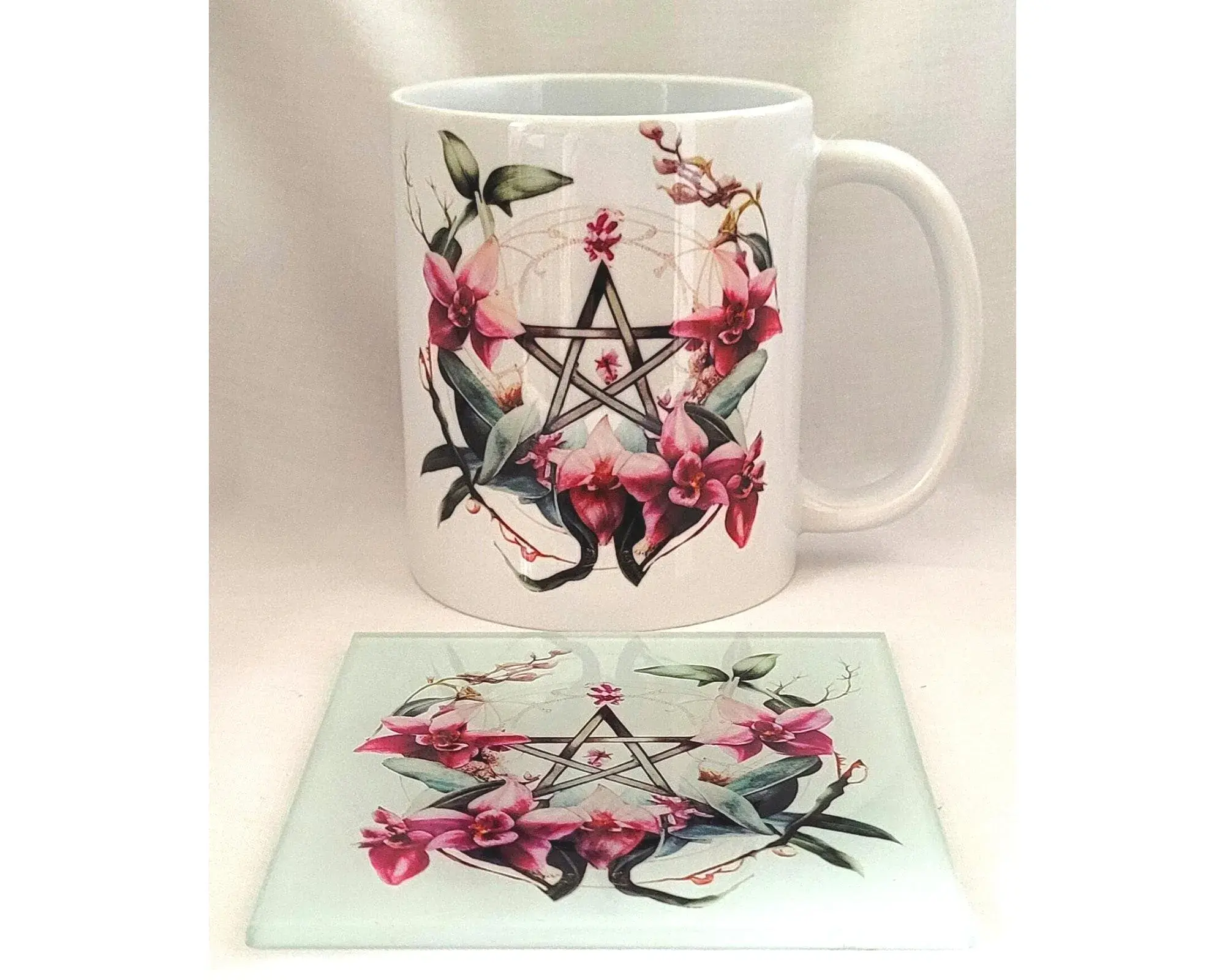 floral pentagram witchy mug with matching glass coaster featuring pink flowers and gothic design