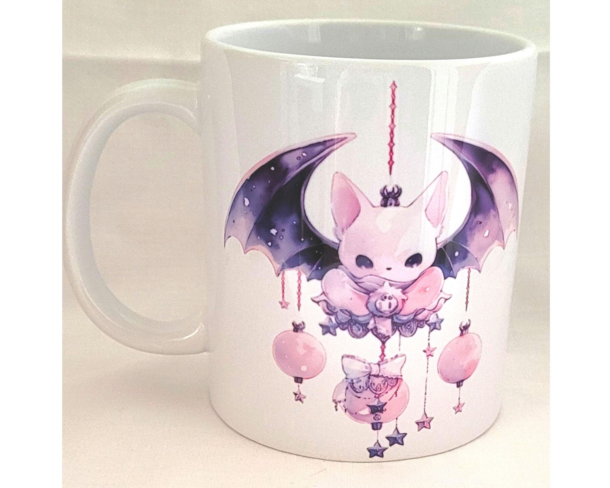 white ceramic pastel bat mug with kawaii gothic design and purple wings