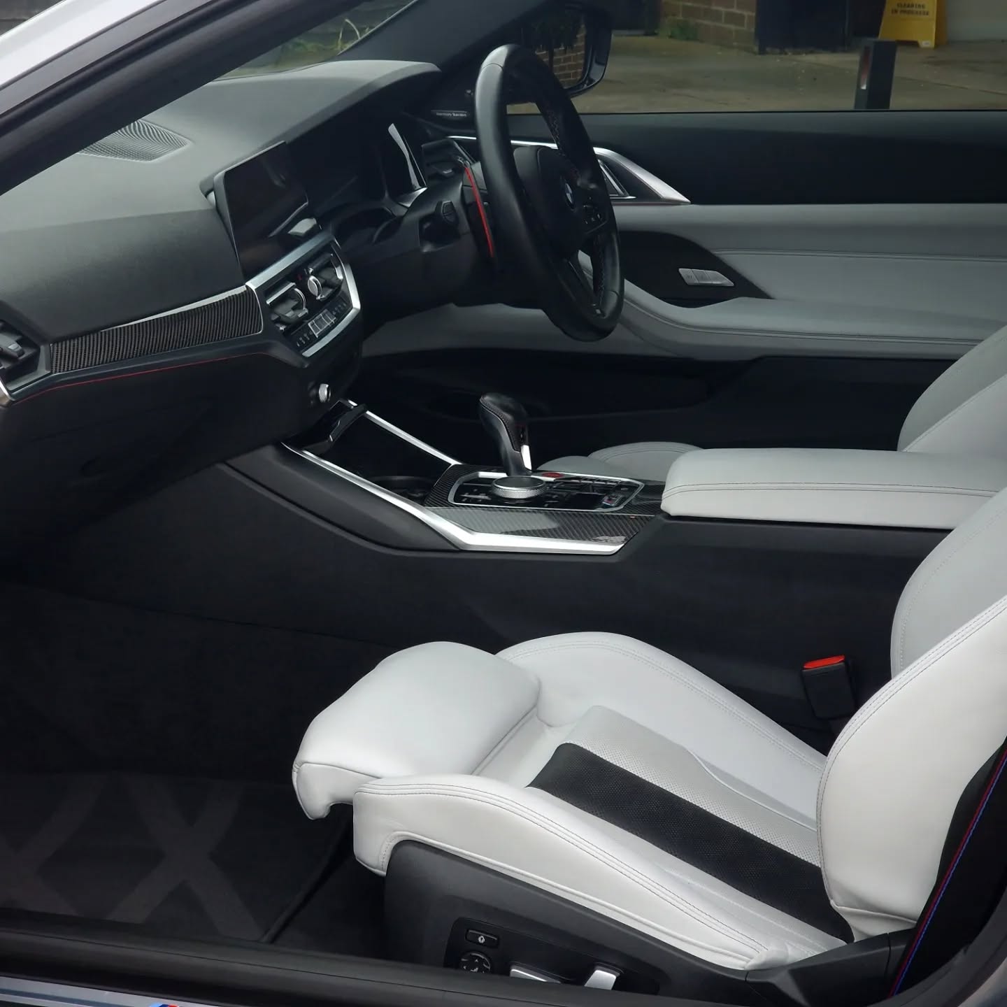 Clean BMW interior, white leather seats