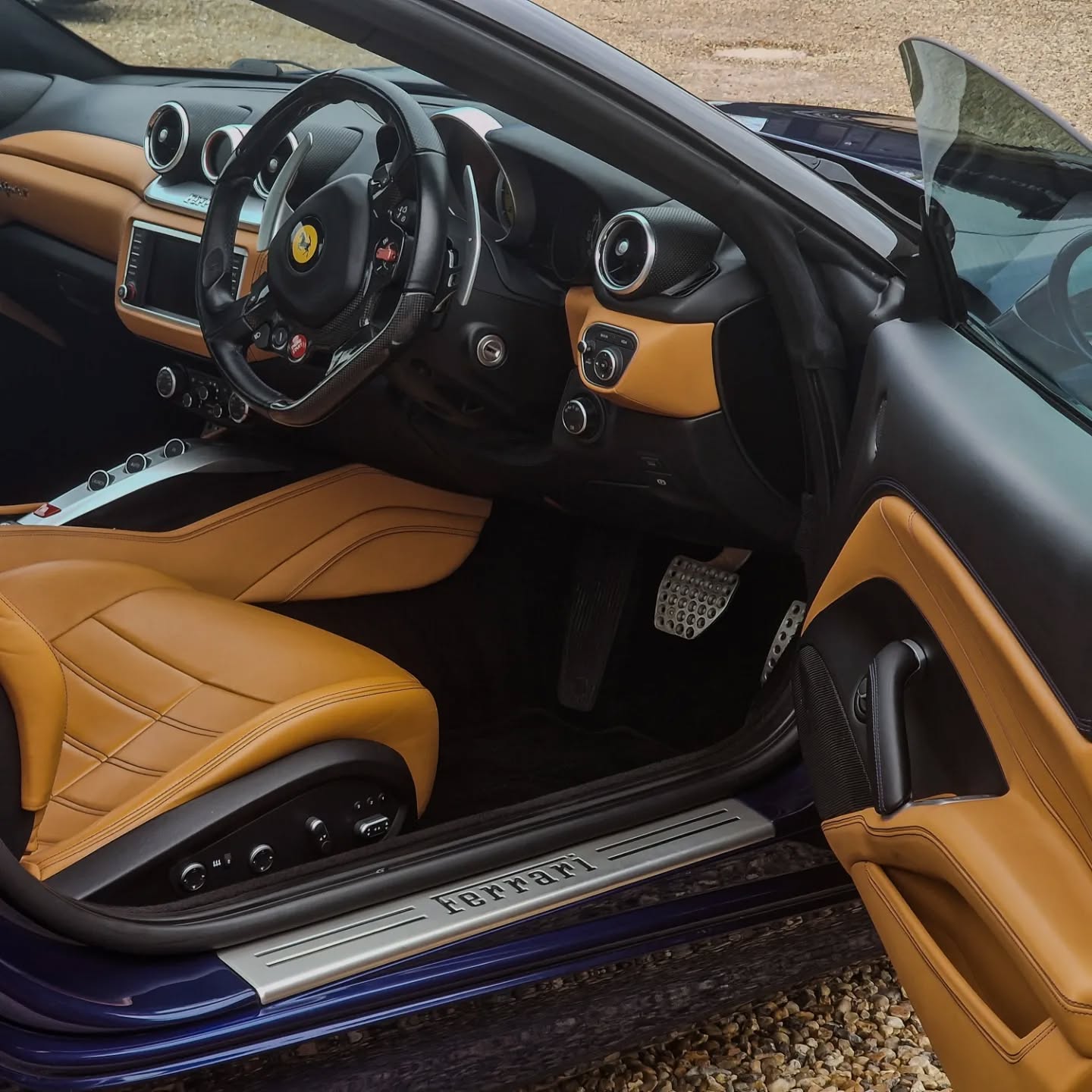 Ferrari 458 Italia interior: tan leather seats, detailed dashboard