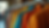 Close-up view of vintage clothing rack with colorful jackets