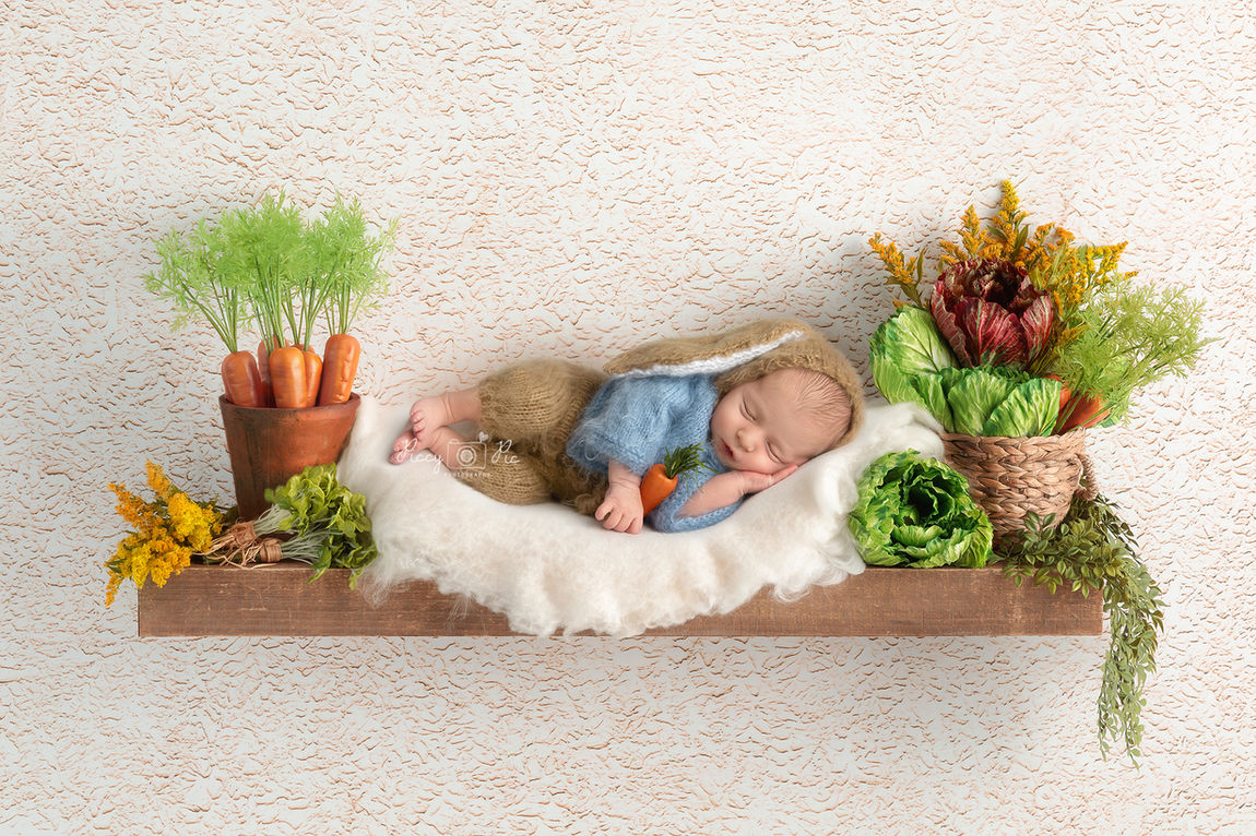 baby wearing Peter Rabbit knitted romper by Hailsham baby photographer