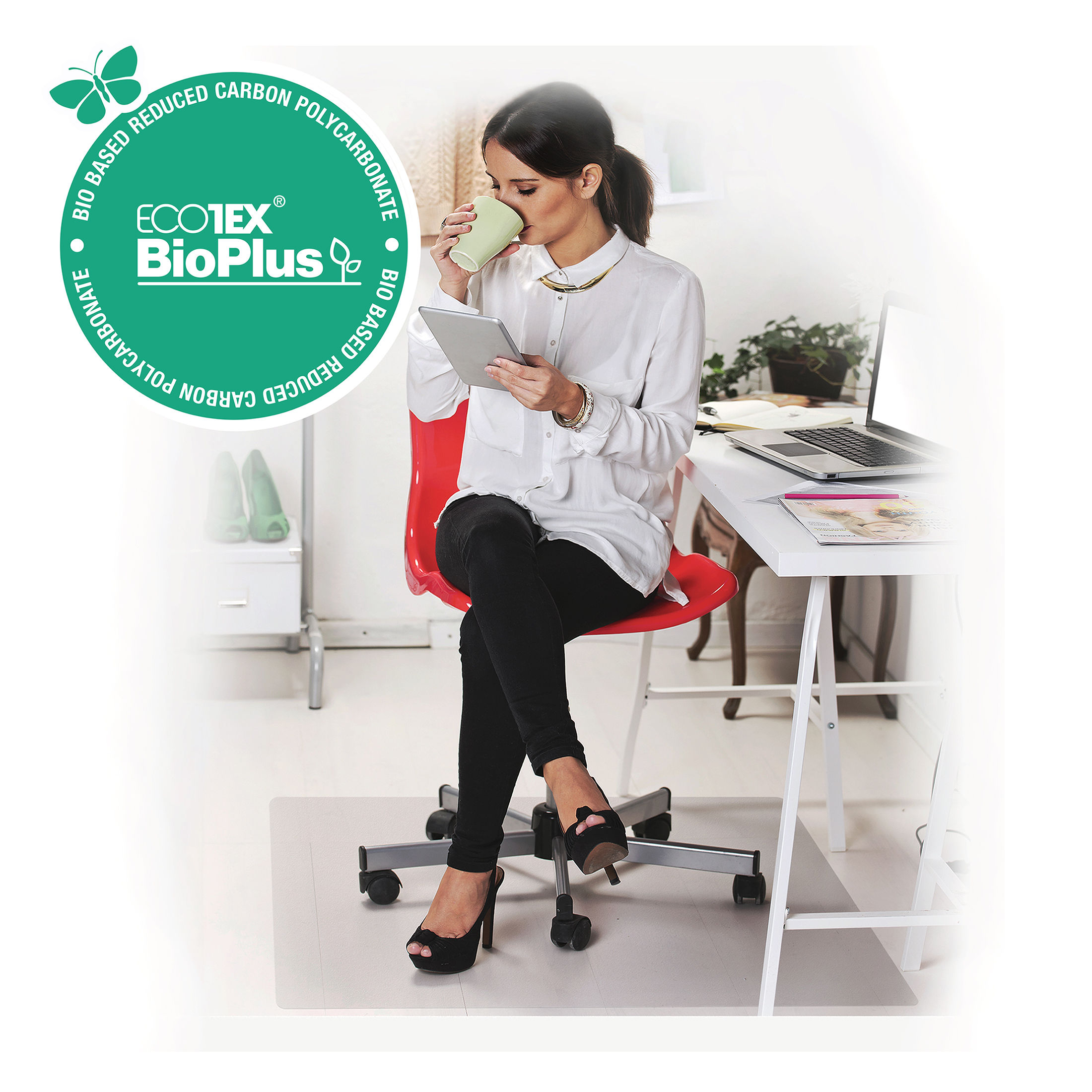 Lady sitting at desk with chair on Floortex EcoTex BioPlus Polycarbonate Rectangular Chair Mat for Hard Floors, with logo