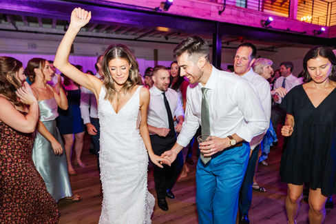 Newlyweds dancing on dance floor